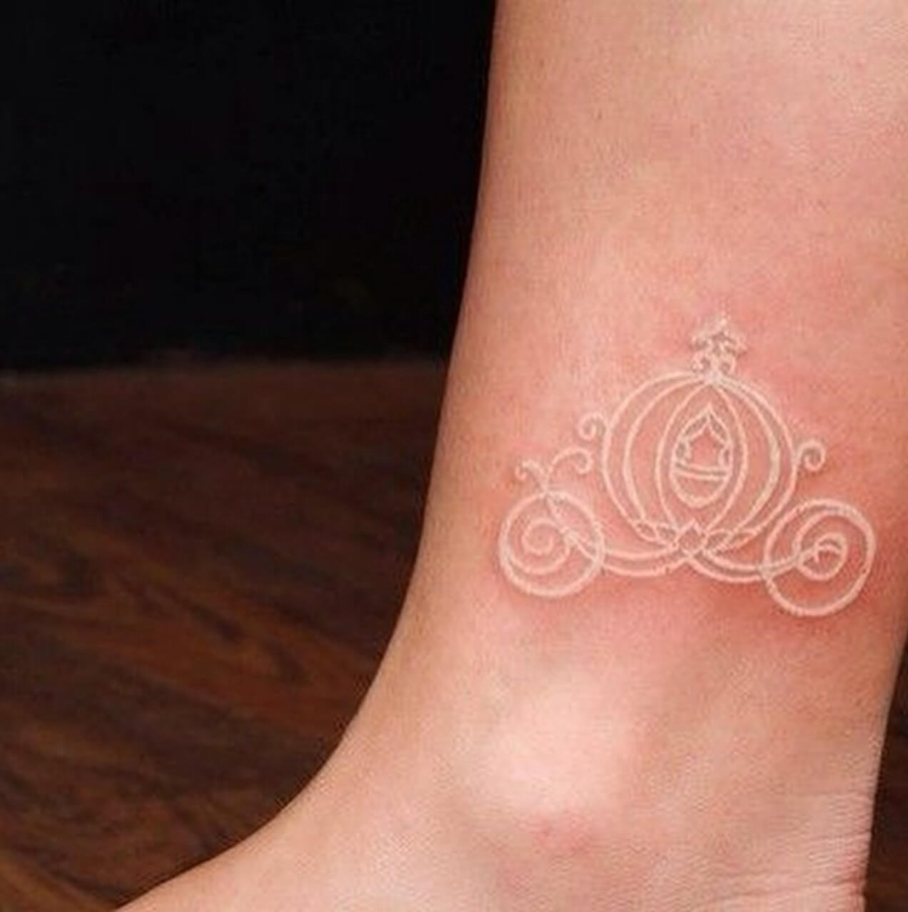 Cinderella carrous tattoo made with white ink