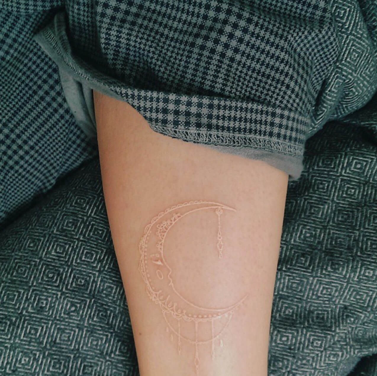 Moon tattoo made with white ink