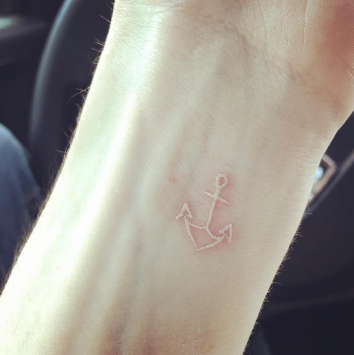 Anchor tattoo made with white ink