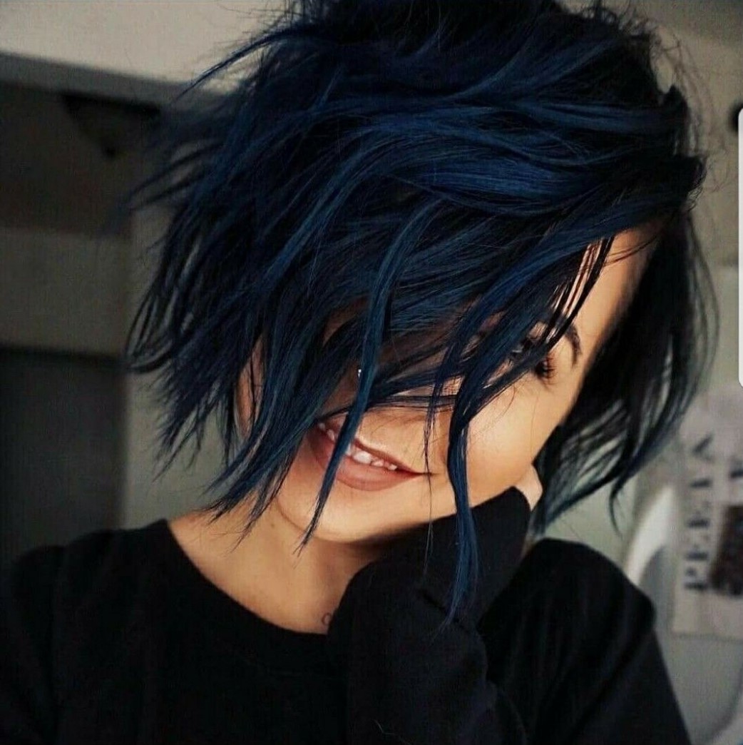 Girl covering her face with her short hair in navy blue tone
