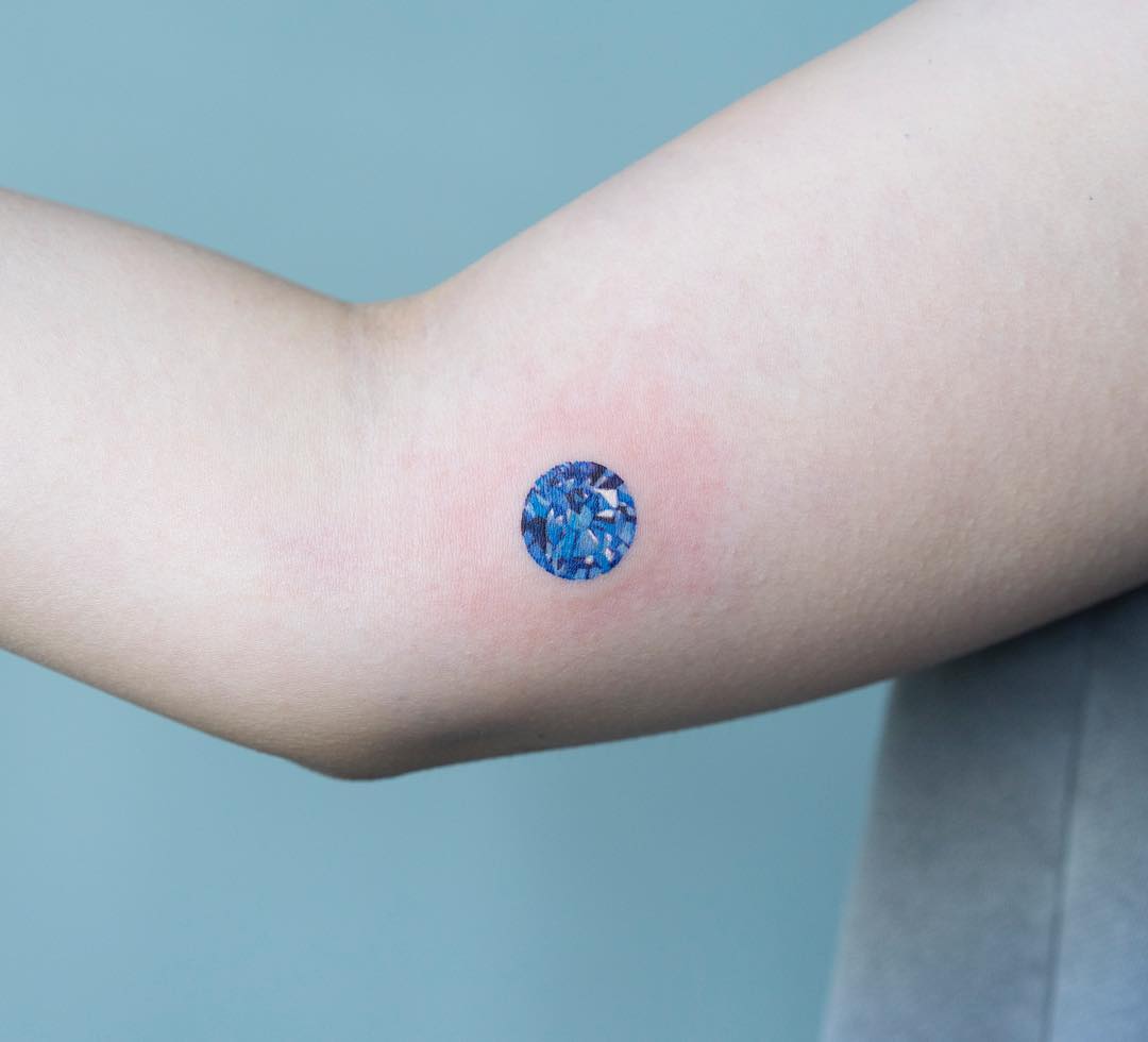 Girl with a tattoo of a diamond