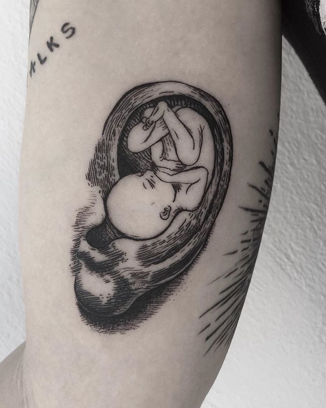 Baby tattoo inside an ear