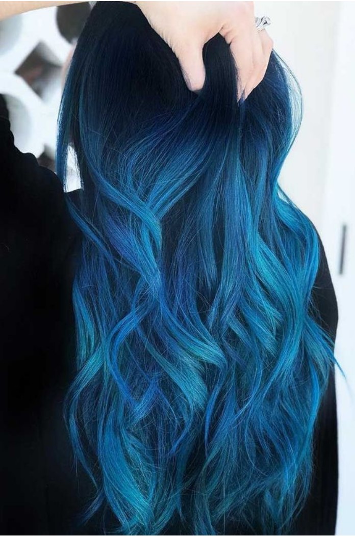 Girl from behind showing her hair in electric blue tone
