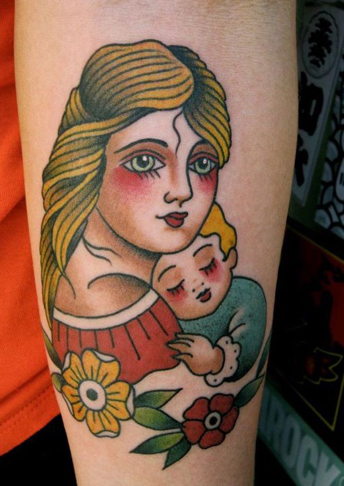Old school tattoo of mom carrying her son