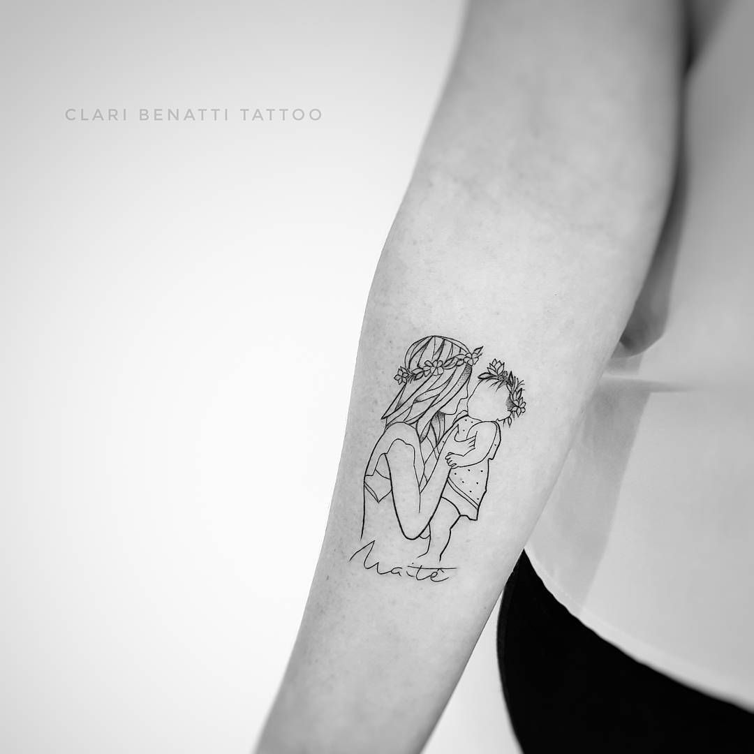 Minimalist tattoo of mom carrying her baby