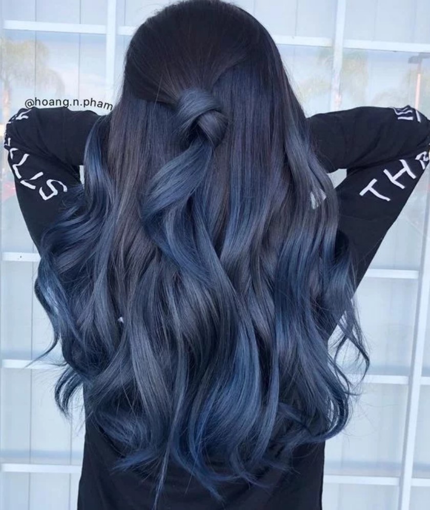 Girl from behind showing her long, blue hair