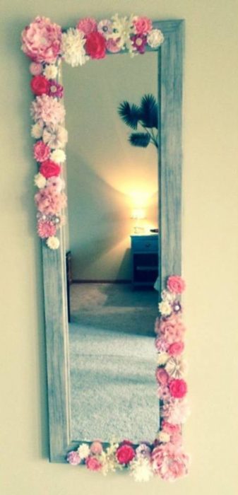 Mirror decorated with flowers in maiden apartment