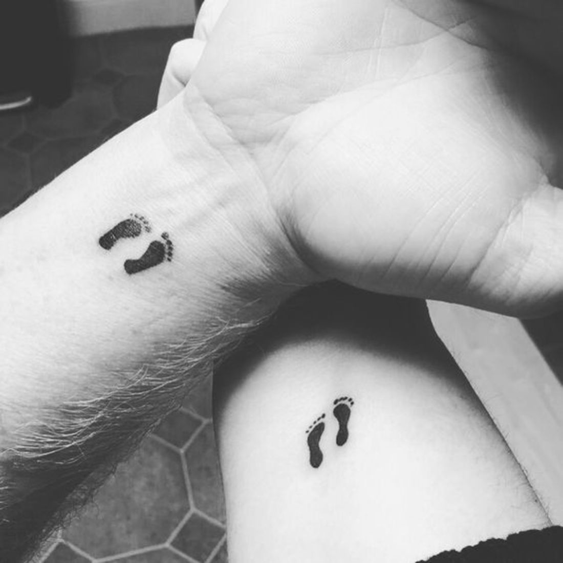 Tattoo of footprints of a baby