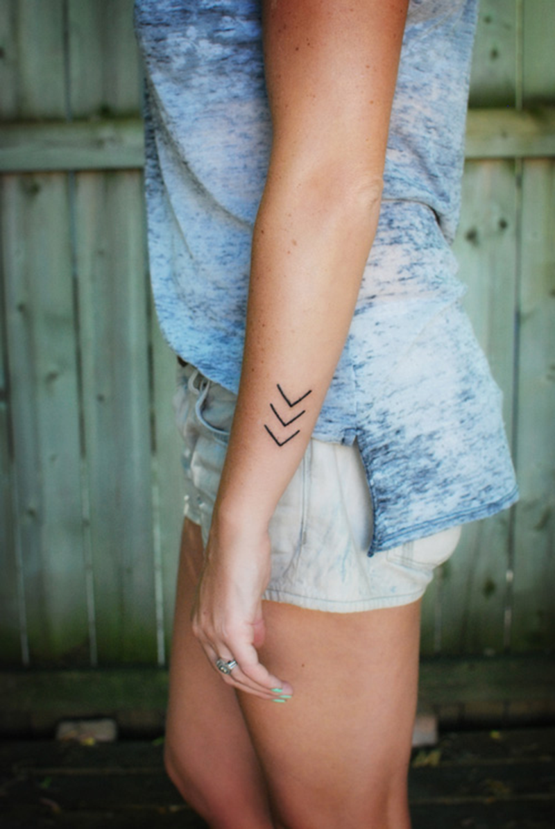 Tattoo arrows down